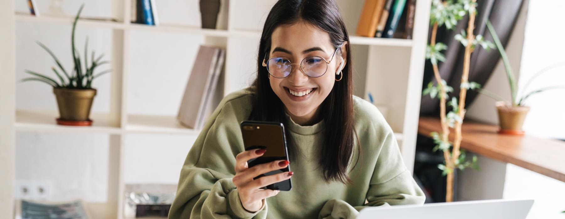 a woman holding a phone