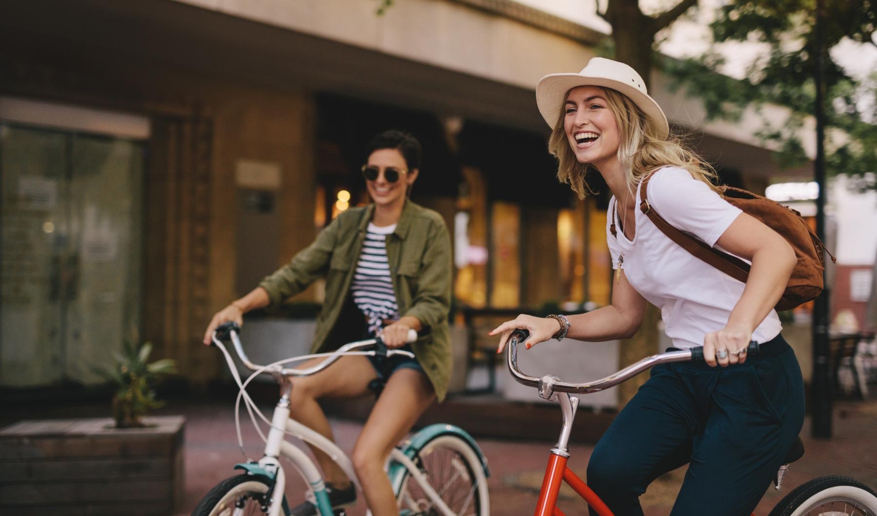 two woman riding bikes