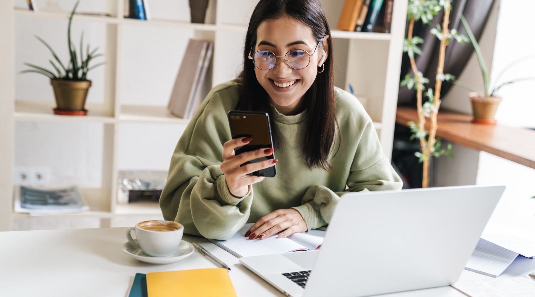 a woman holding a phone