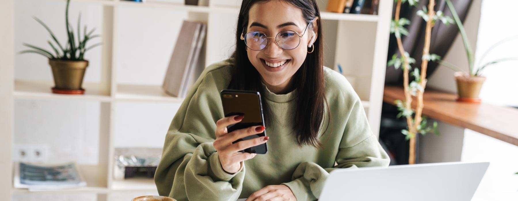 a woman holding a phone