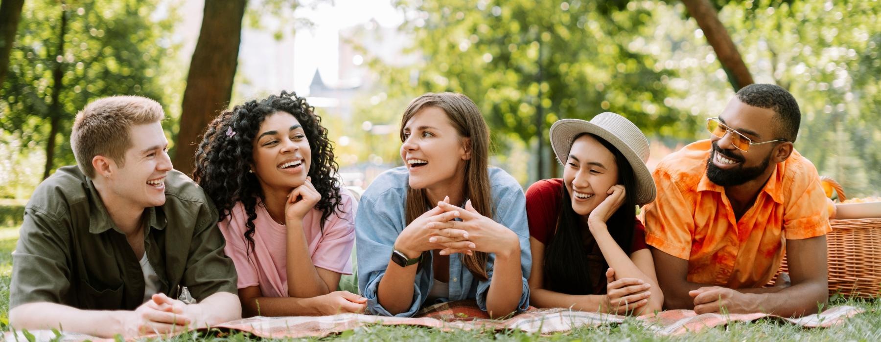 a group of people sitting on the ground